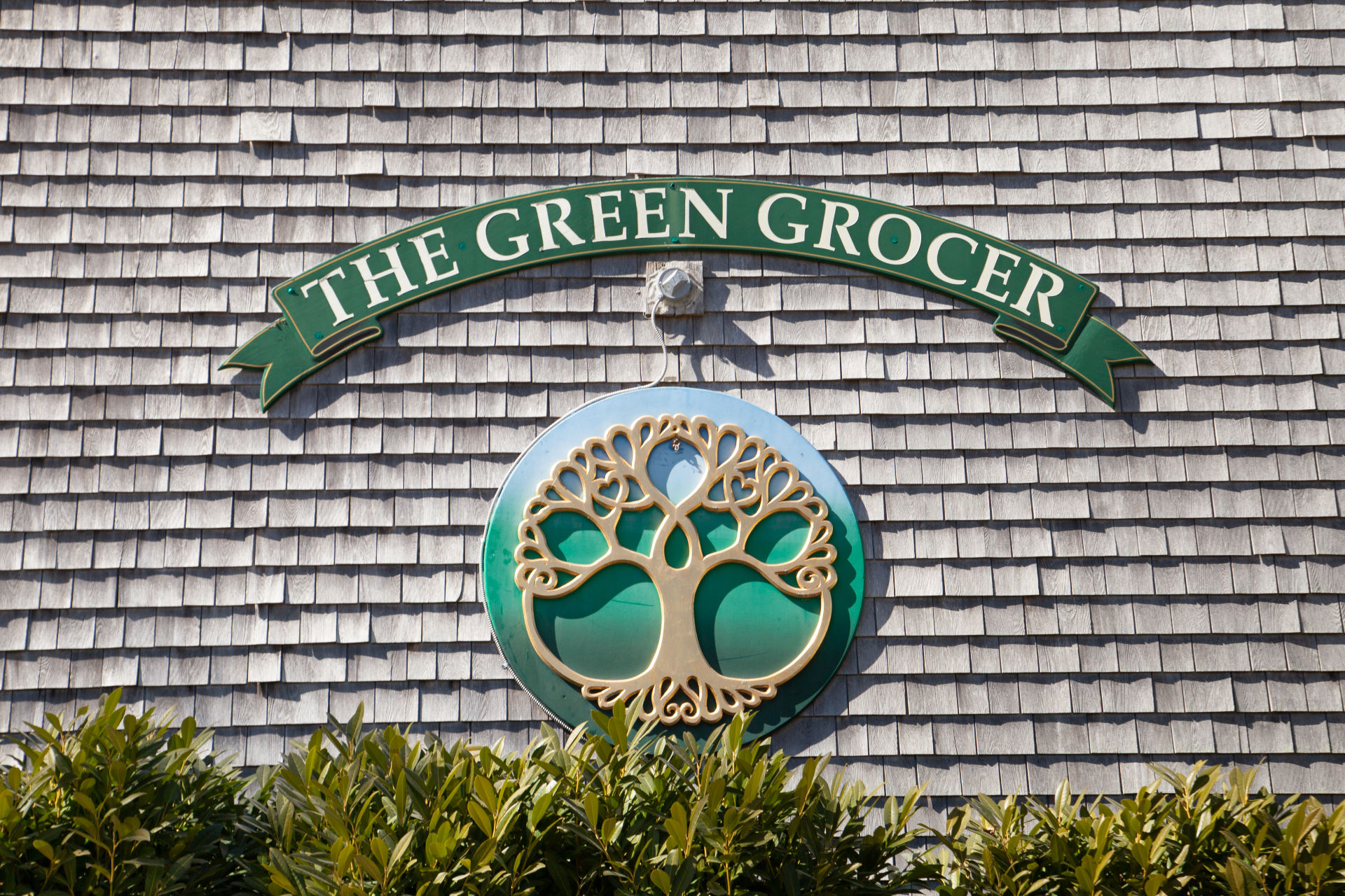 The Green Grocer logo on front of store